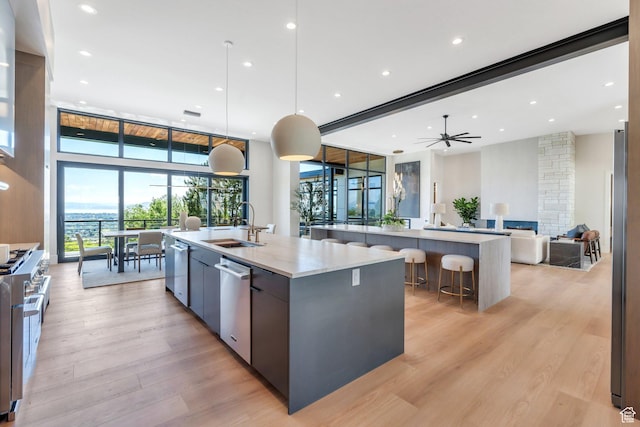 3943 N Foothill Dr, Provo, UT 84604 - kitchen featuring a large island with sink, modern cabinets, open floor plan, stainless steel appliances, and recessed lighting