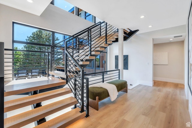 3943 N Foothill Dr, Provo, UT 84604 - stairs with baseboards, wood finished floors, and recessed lighting