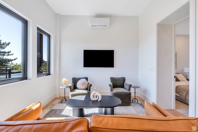 3943 N Foothill Dr, Provo, UT 84604 - sitting room featuring a wall mounted AC, wood finished floors, and baseboards