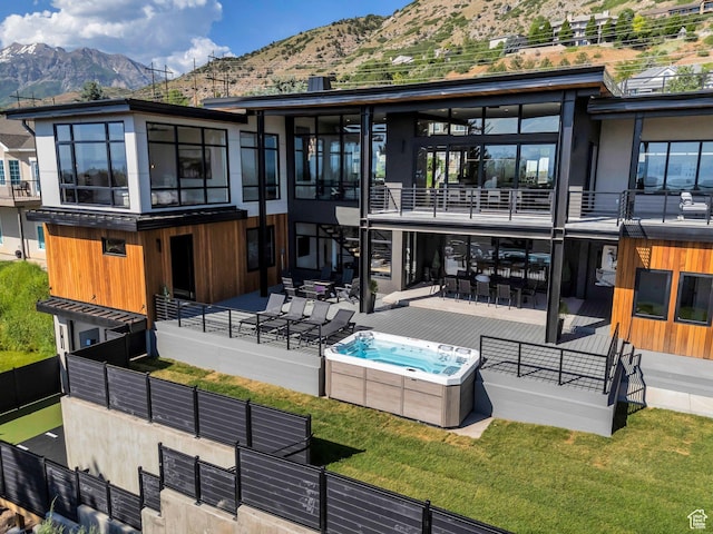 3943 N Foothill Dr, Provo, UT 84604 - rear view of house with a hot tub, a mountain view, a balcony, and a patio area