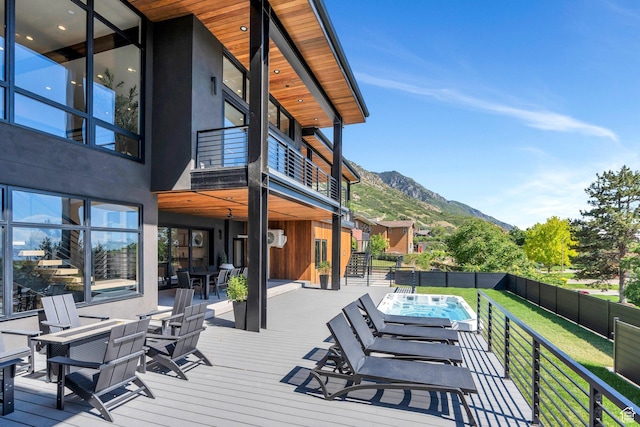 3943 N Foothill Dr, Provo, UT 84604 - wooden terrace featuring a fenced backyard, an outdoor hot tub, a mountain view, and outdoor dining area
