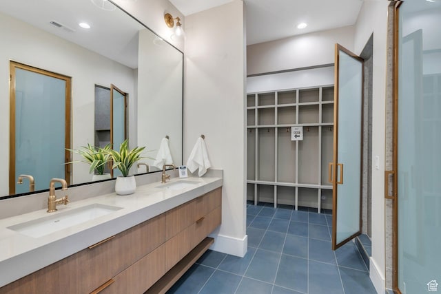3943 N Foothill Dr, Provo, UT 84604 - bathroom featuring double vanity, tile patterned flooring, baseboards, and a spacious closet