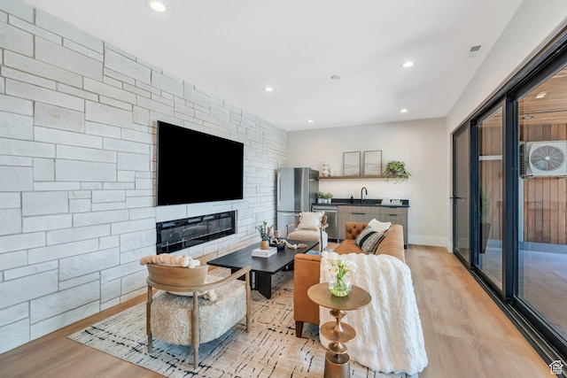 3943 N Foothill Dr, Provo, UT 84604 - living area featuring light wood-style floors, recessed lighting, and a fireplace