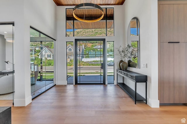 3943 N Foothill Dr, Provo, UT 84604 - entryway featuring a high ceiling, plenty of natural light, wood ceiling, wood finished floors, and baseboards