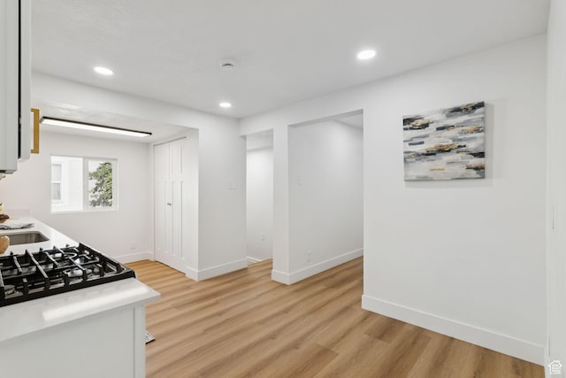 155 W 800 N, Spanish Fork, UT 84660 - kitchen featuring light wood-style floors, recessed lighting, baseboards, cooktop, and light countertops