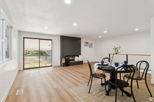 155 W 800 N, Spanish Fork, UT 84660 - dining room featuring a fireplace, baseboards, recessed lighting, and light wood-style floors