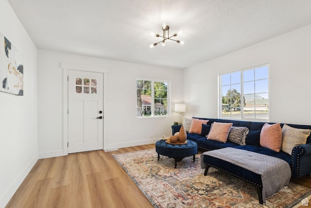 155 W 800 N, Spanish Fork, UT 84660 - living area featuring a chandelier, light wood-type flooring, and baseboards