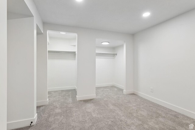155 W 800 N, Spanish Fork, UT 84660 - unfurnished bedroom with carpet flooring, baseboards, recessed lighting, and multiple closets