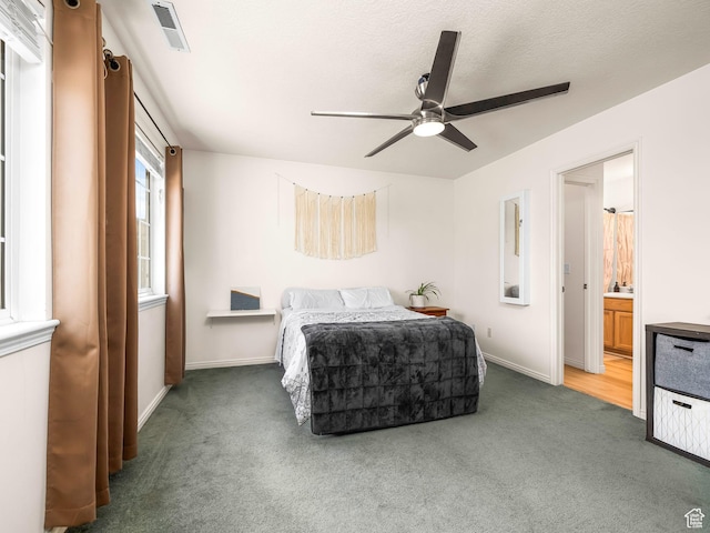 4113 E Cattle Dr, Eagle Mountain, UT 84005 - carpeted bedroom featuring baseboards, ensuite bathroom, and ceiling fan