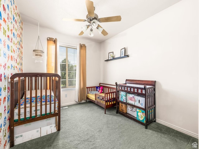 4113 E Cattle Dr, Eagle Mountain, UT 84005 - carpeted bedroom with baseboards, a ceiling fan, and a crib