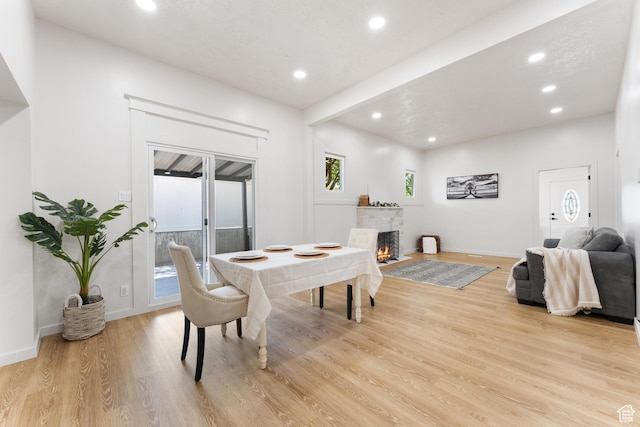 2802 W 5600 S, Roy, UT 84067 - dining area with light wood-style floors, recessed lighting, a fireplace with flush hearth, and baseboards