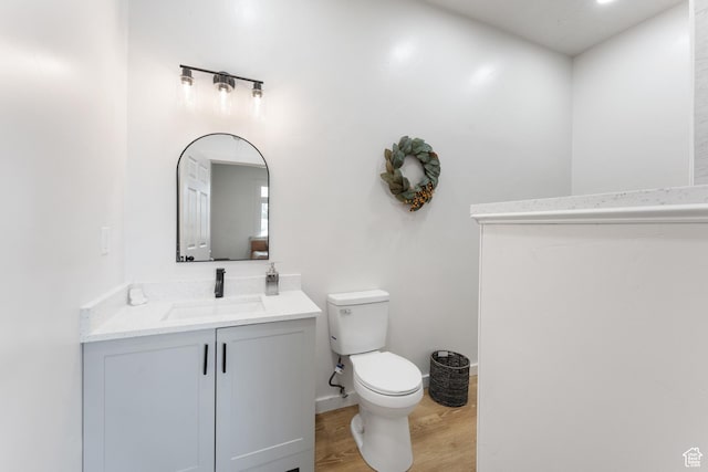 2802 W 5600 S, Roy, UT 84067 - half bath with toilet, wood finished floors, vanity, and baseboards
