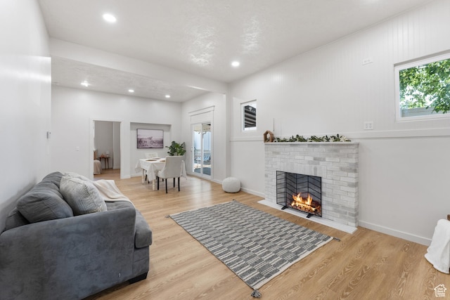 2802 W 5600 S, Roy, UT 84067 - living area featuring healthy amount of natural light, wood finished floors, recessed lighting, and a fireplace