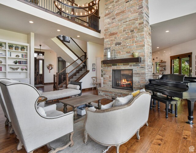 707 N Chimney Rock Rd, Heber City, UT 84032 - living room featuring hardwood / wood-style flooring, a towering ceiling, a chandelier, a fireplace, and recessed lighting