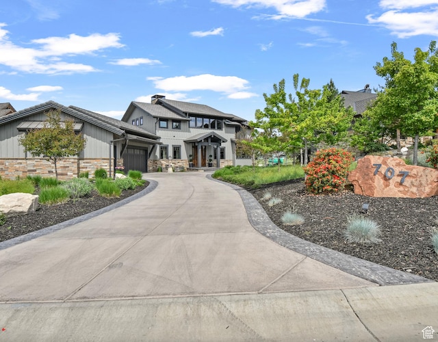 707 N Chimney Rock Rd, Heber City, UT 84032 - view of front of property featuring an attached garage, driveway, stone siding, and board and batten siding