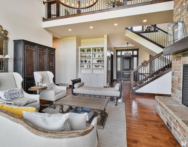 707 N Chimney Rock Rd, Heber City, UT 84032 - living room with a towering ceiling, stairway, hardwood / wood-style floors, a chandelier, and recessed lighting