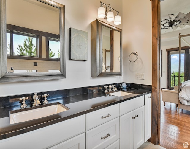 707 N Chimney Rock Rd, Heber City, UT 84032 - bathroom with double vanity, wood finished floors, and ensuite bath