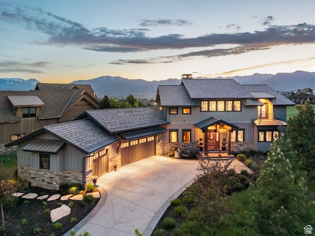 707 N Chimney Rock Rd, Heber City, UT 84032 - view of front of home with stone siding, an attached garage, a mountain view, and board and batten siding