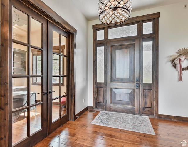 707 N Chimney Rock Rd, Heber City, UT 84032 - entryway featuring baseboards, french doors, hardwood / wood-style floors, and a chandelier
