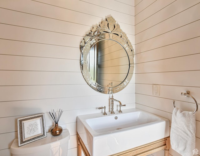 707 N Chimney Rock Rd, Heber City, UT 84032 - bathroom featuring wood walls and vanity