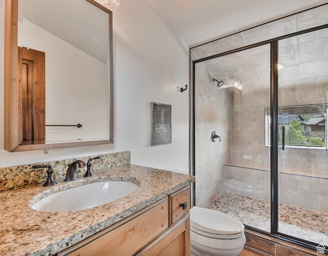 707 N Chimney Rock Rd, Heber City, UT 84032 - bathroom featuring toilet, a stall shower, and vanity