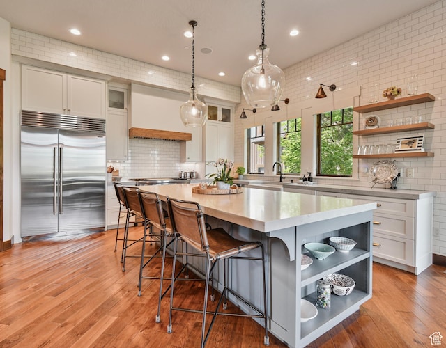 707 N Chimney Rock Rd, Heber City, UT 84032 - kitchen with open shelves, stainless steel built in refrigerator, white cabinetry, light countertops, and recessed lighting