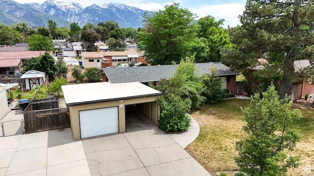 1820 E Meadow Dr S, Cottonwood Heights, UT 84121 - view of front of property with a garage, a residential view, a mountain view, and concrete driveway