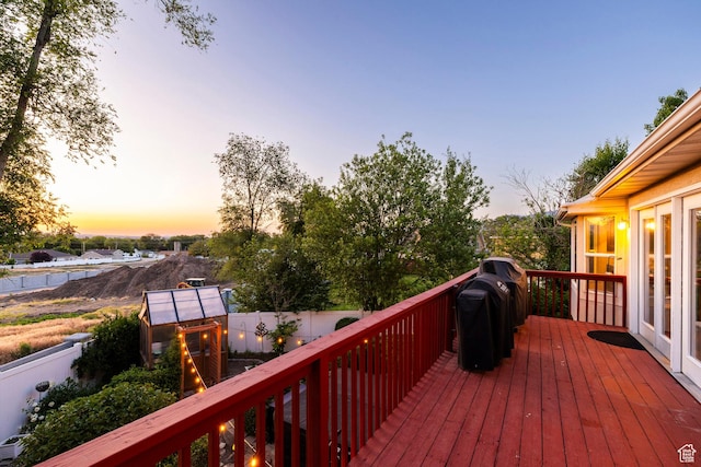 13898 Summerset Cir, Draper, UT 84020 - deck at dusk with area for grilling and a fenced backyard