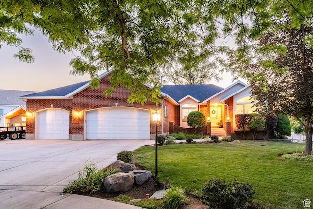 13898 Summerset Cir, Draper, UT 84020 - ranch-style house with driveway, an attached garage, a front yard, and brick siding