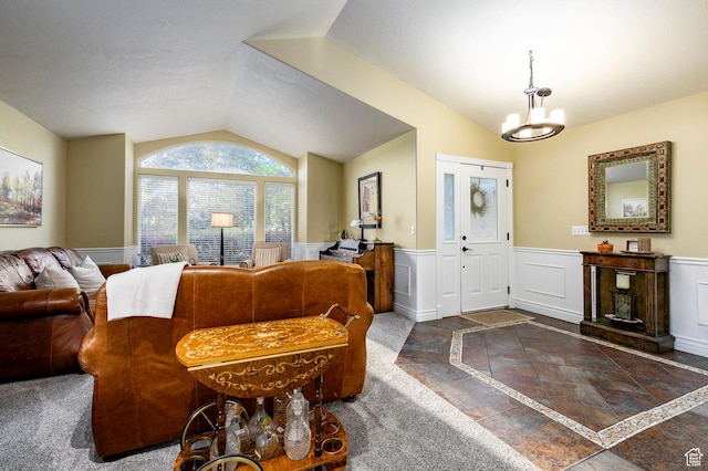 13898 Summerset Cir, Draper, UT 84020 - foyer entrance with inlaid floor details, lofted ceiling, wainscoting, and a chandelier