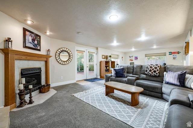 13898 Summerset Cir, Draper, UT 84020 - carpeted living area featuring french doors, a tiled fireplace, a textured ceiling, and baseboards