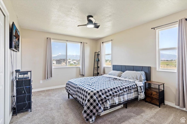 2373 S 2830 W, Syracuse, UT 84075 - bedroom featuring carpet floors, baseboards, a textured ceiling, and ceiling fan