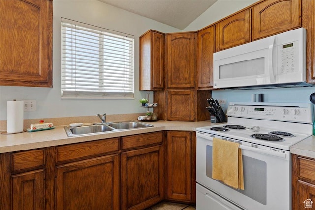 2373 S 2830 W, Syracuse, UT 84075 - kitchen featuring white appliances, a sink, light countertops, and brown cabinets