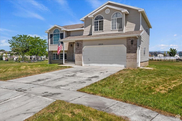 2373 S 2830 W, Syracuse, UT 84075 - view of front of property with brick siding, a front lawn, driveway, and a garage