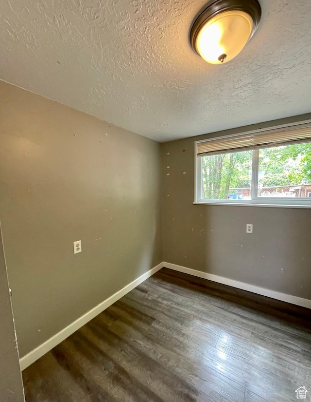 947 W 1300 N, Carbonville, UT 84501 - unfurnished room with a textured ceiling, baseboards, and wood finished floors