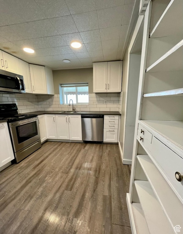 947 W 1300 N, Carbonville, UT 84501 - kitchen with appliances with stainless steel finishes, a sink, open shelves, and white cabinetry