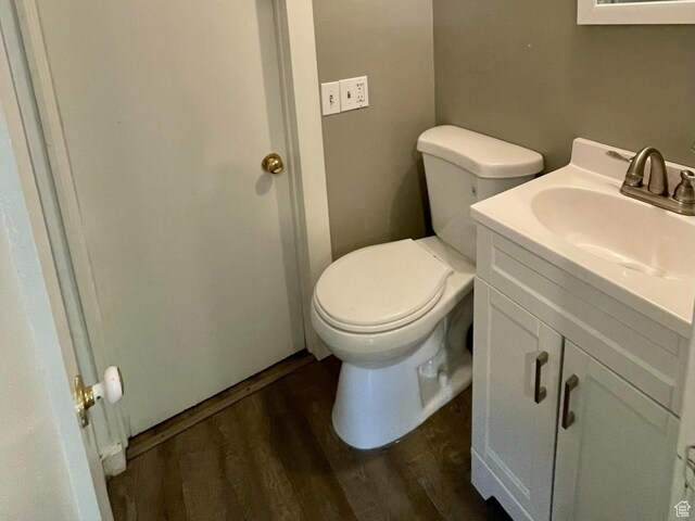 947 W 1300 N, Carbonville, UT 84501 - bathroom featuring wood finished floors, toilet, and vanity