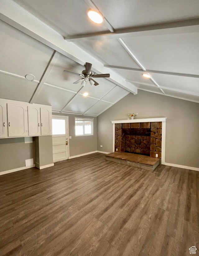 947 W 1300 N, Carbonville, UT 84501 - unfurnished living room featuring baseboards, dark wood-style flooring, a ceiling fan, and a fireplace
