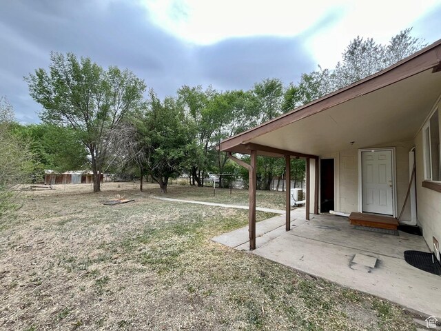 947 W 1300 N, Carbonville, UT 84501 - view of grassy yard with a patio area