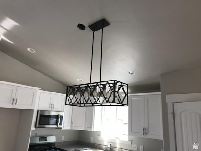 1515 N 250 E, Nephi, UT 84648 - kitchen featuring stainless steel appliances, white cabinetry, recessed lighting, and vaulted ceiling