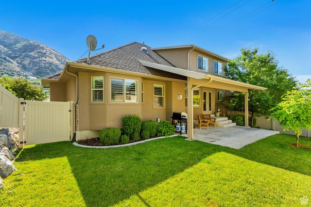 849 N 400 E, Springville, UT 84663 - rear view of house featuring stucco siding, a patio area, a mountain view, and a shingled roof