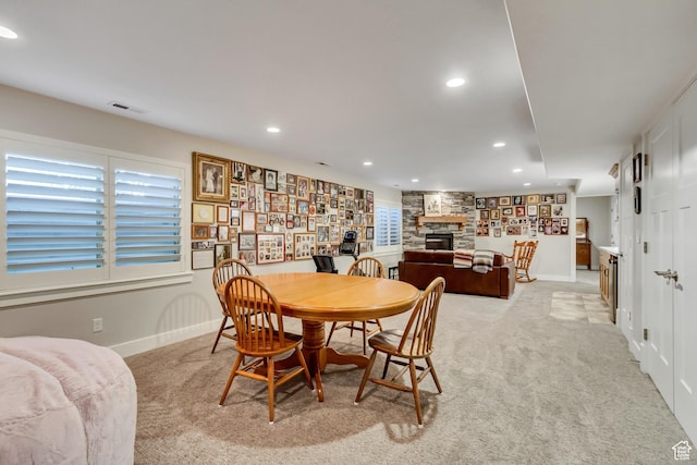849 N 400 E, Springville, UT 84663 - dining space featuring light colored carpet, baseboards, a fireplace, and recessed lighting