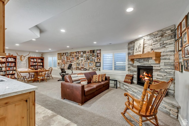 849 N 400 E, Springville, UT 84663 - living room featuring light colored carpet, recessed lighting, a stone fireplace, and light tile patterned flooring