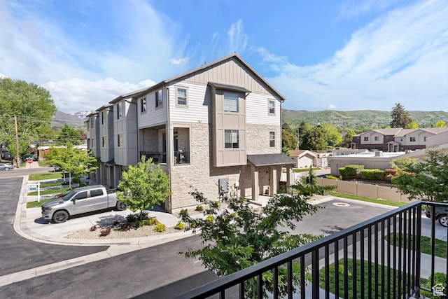 1940 S 200 W Unit 11, Bountiful, UT 84010 - view of side of home with stone siding, a mountain view, and board and batten siding