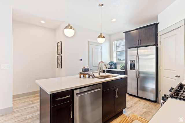 1940 S 200 W Unit 11, Bountiful, UT 84010 - kitchen with stainless steel appliances, light countertops, hanging light fixtures, and recessed lighting
