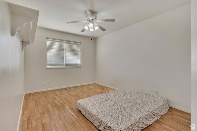 4564 S Early Duke St, West Valley City, UT 84120 - bedroom with light wood-type flooring, baseboards, and ceiling fan