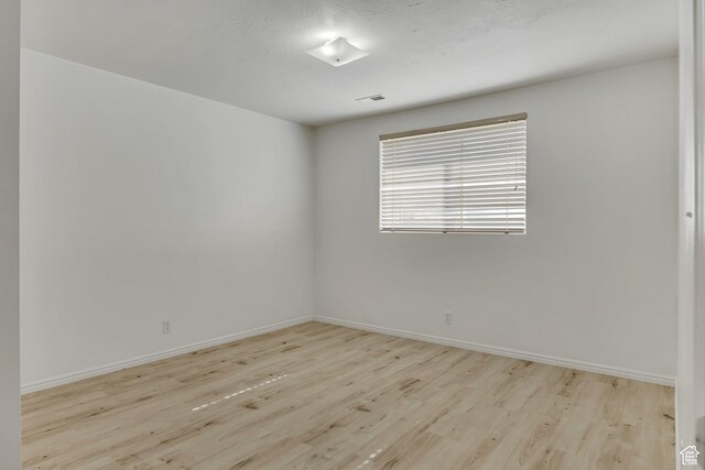 4564 S Early Duke St, West Valley City, UT 84120 - spare room with wood finished floors and baseboards