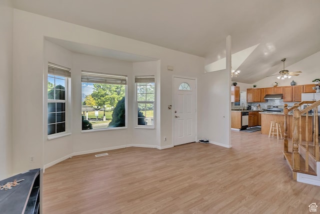4564 S Early Duke St, West Valley City, UT 84120 - foyer with light wood-type flooring, vaulted ceiling, a ceiling fan, and baseboards