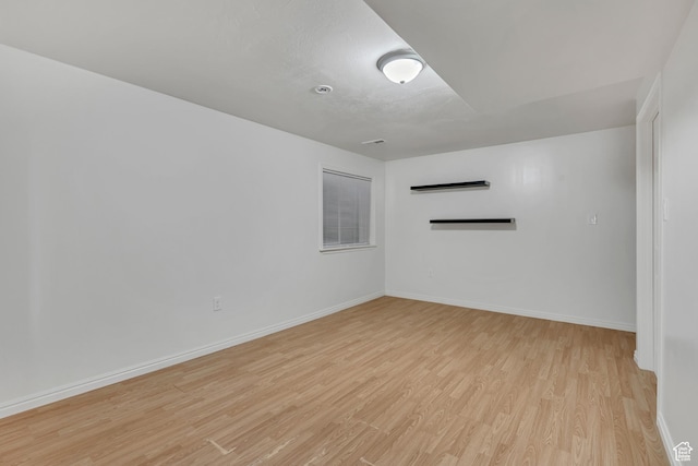 4564 S Early Duke St, West Valley City, UT 84120 - spare room featuring light wood-style flooring and baseboards