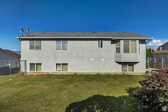 4564 S Early Duke St, West Valley City, UT 84120 - back of house with stucco siding and roof with shingles